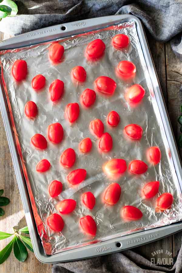 grape tomatoes on a foil-lined baking tray