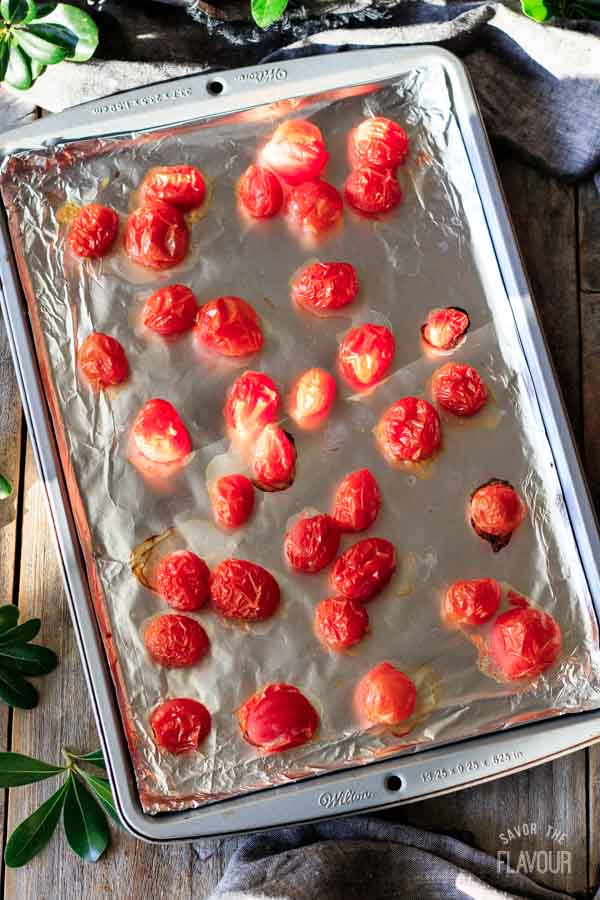 roasted tomatoes on a foil-lined tray