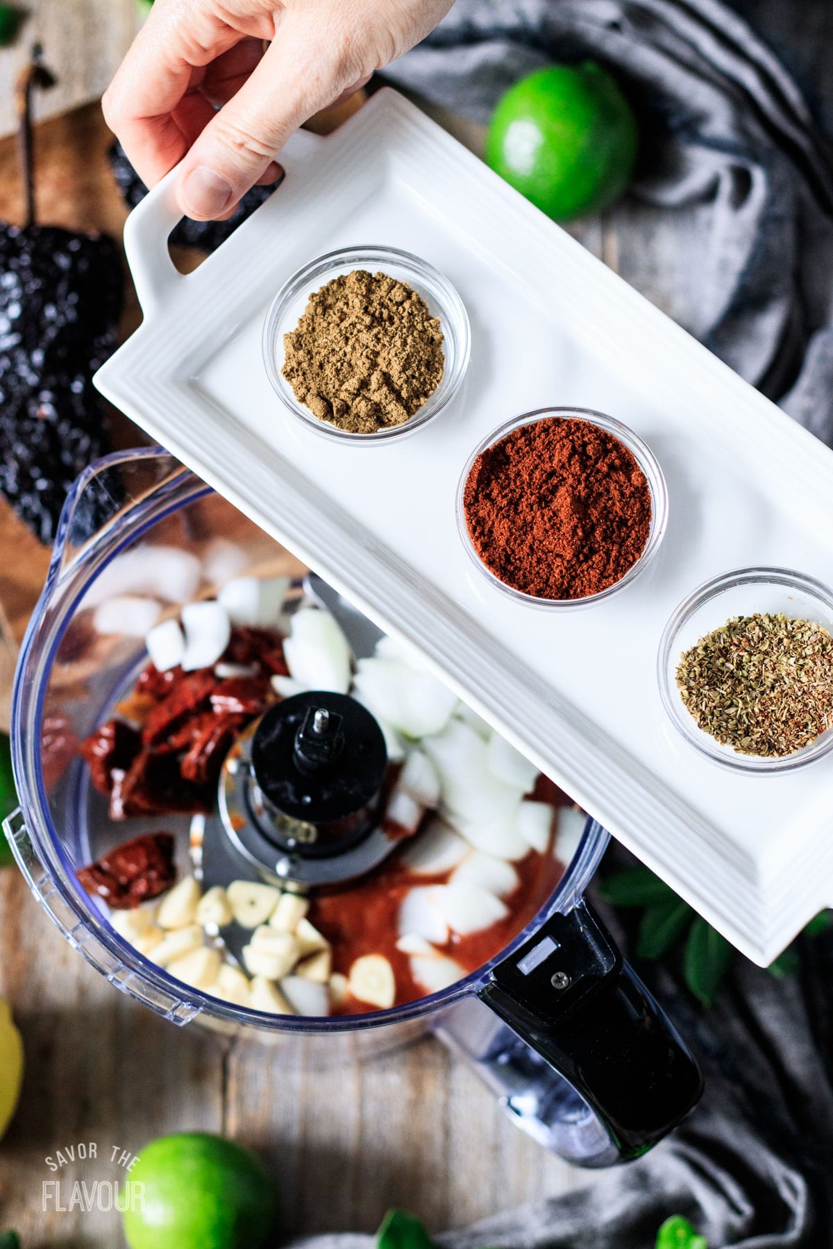 person holding a tray of dried spices