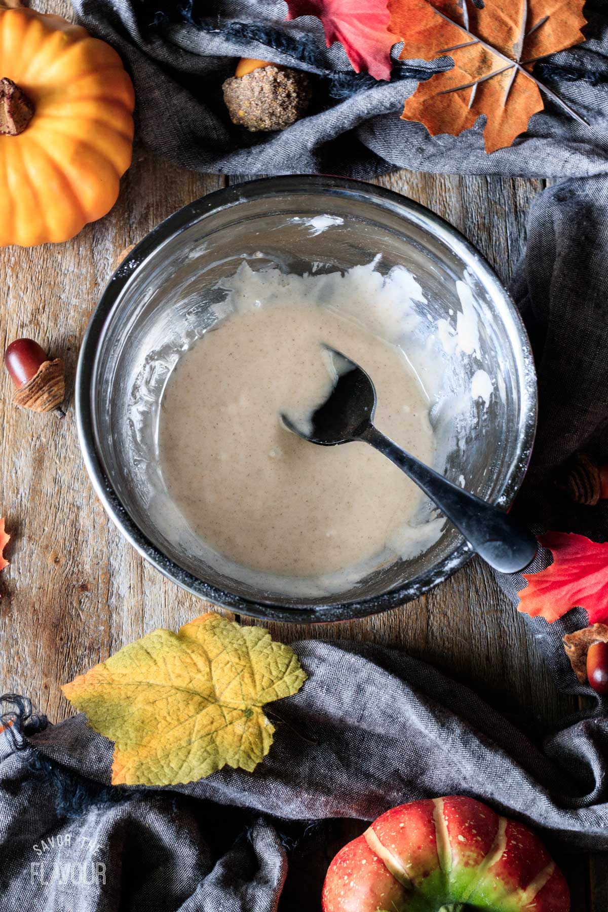 bowl of pumpkin spice glaze for scones