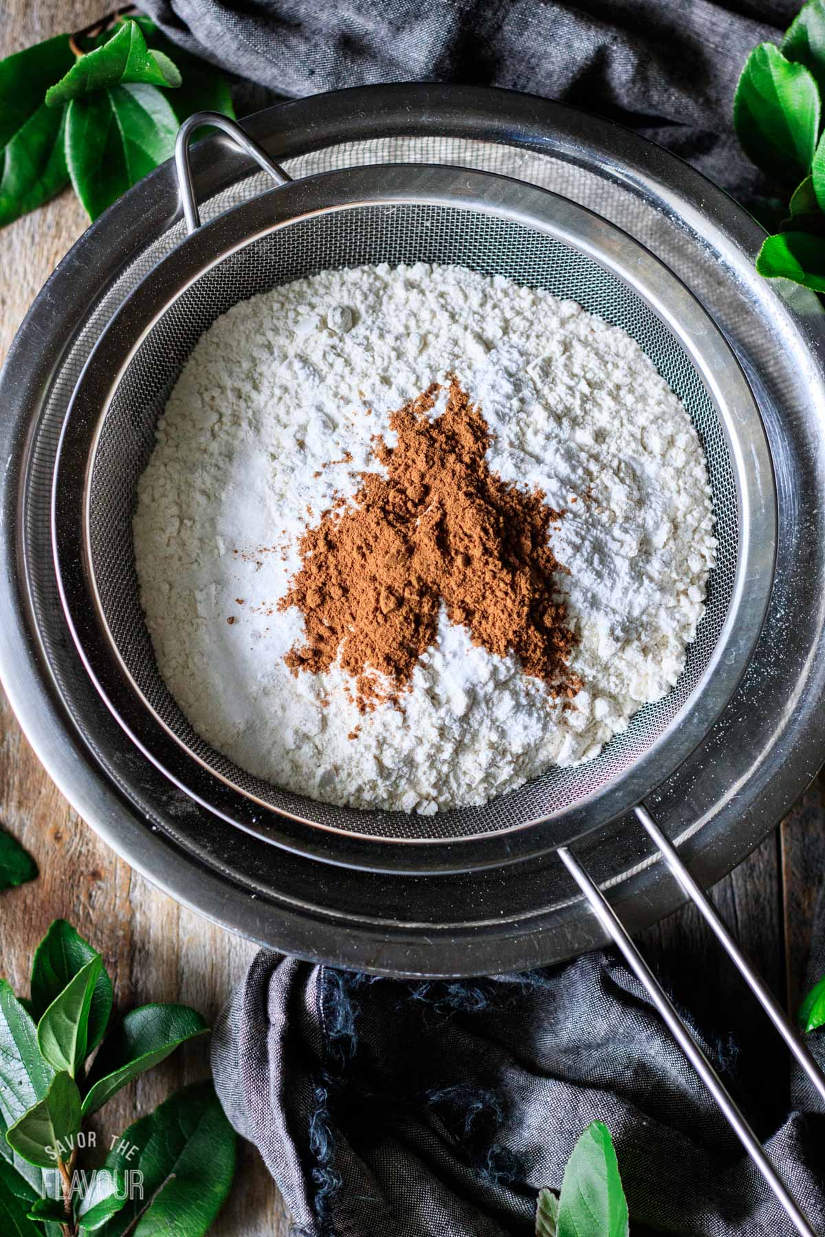 sifting flour and other dry ingredients into a mixing bowl