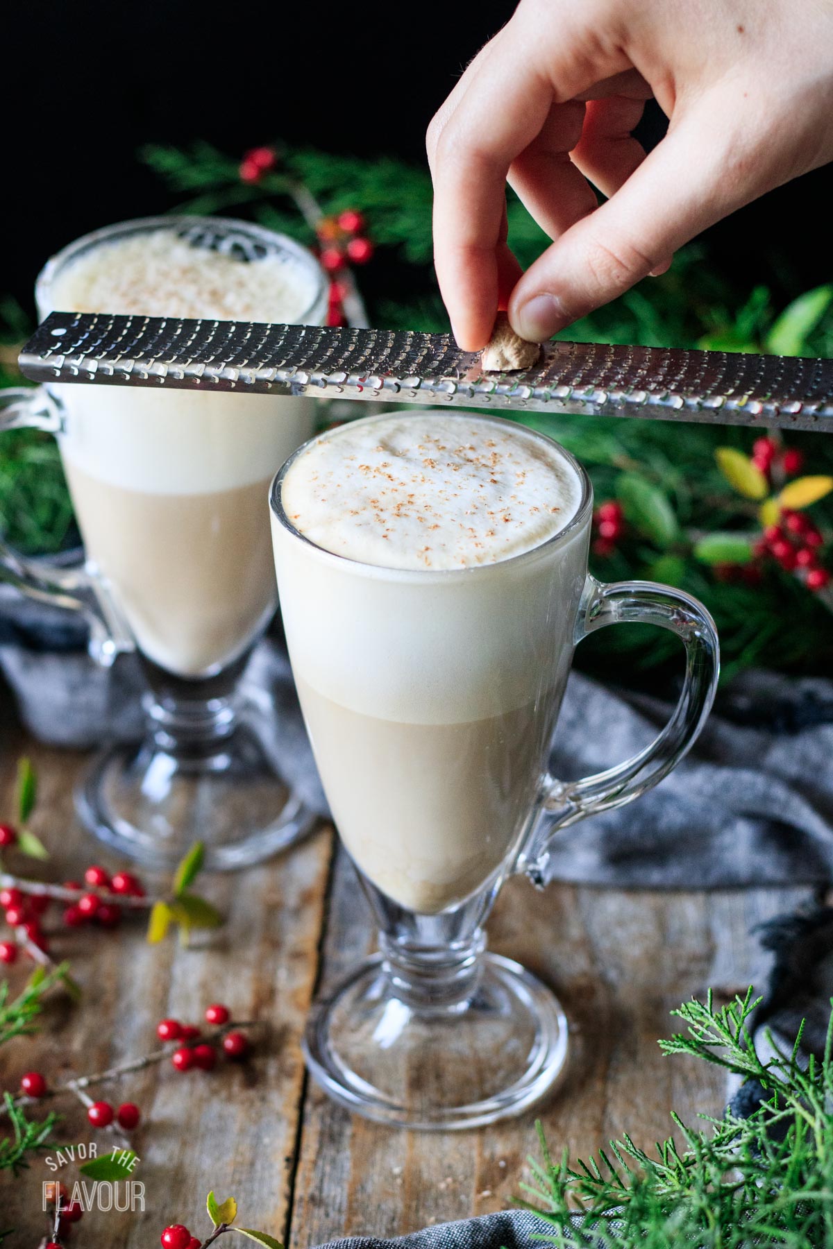 person grating fresh nutmeg on a Starbucks eggnog latte