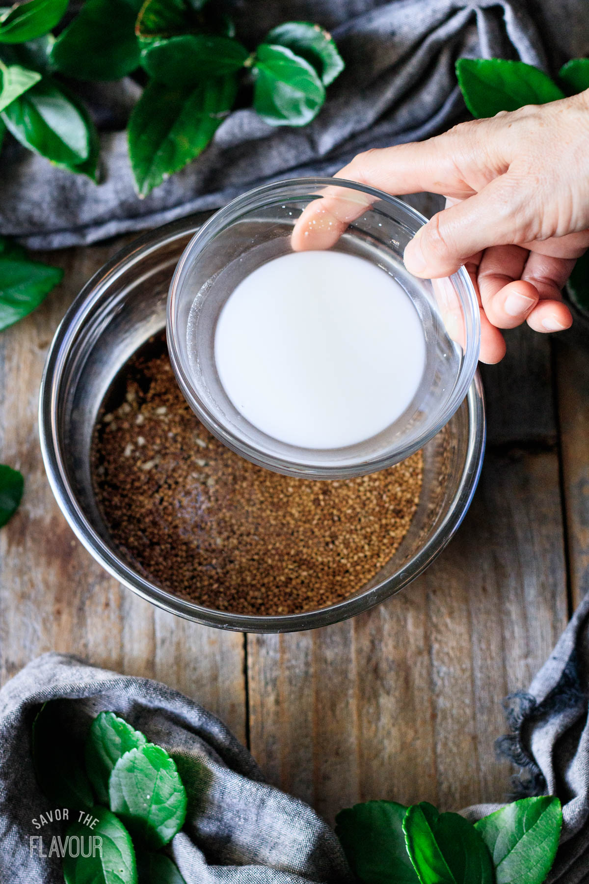 person holding a bowl of cornstarch slurry