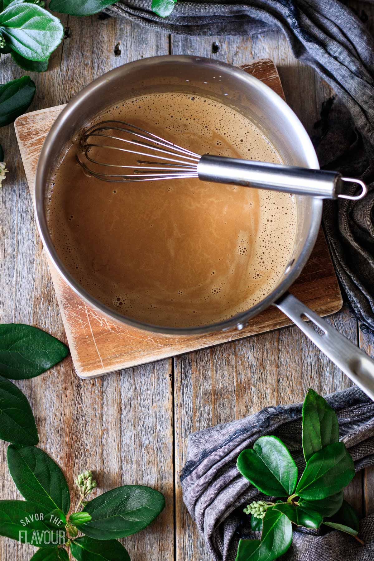 cream, butter, and espresso powder mixture in a saucepan