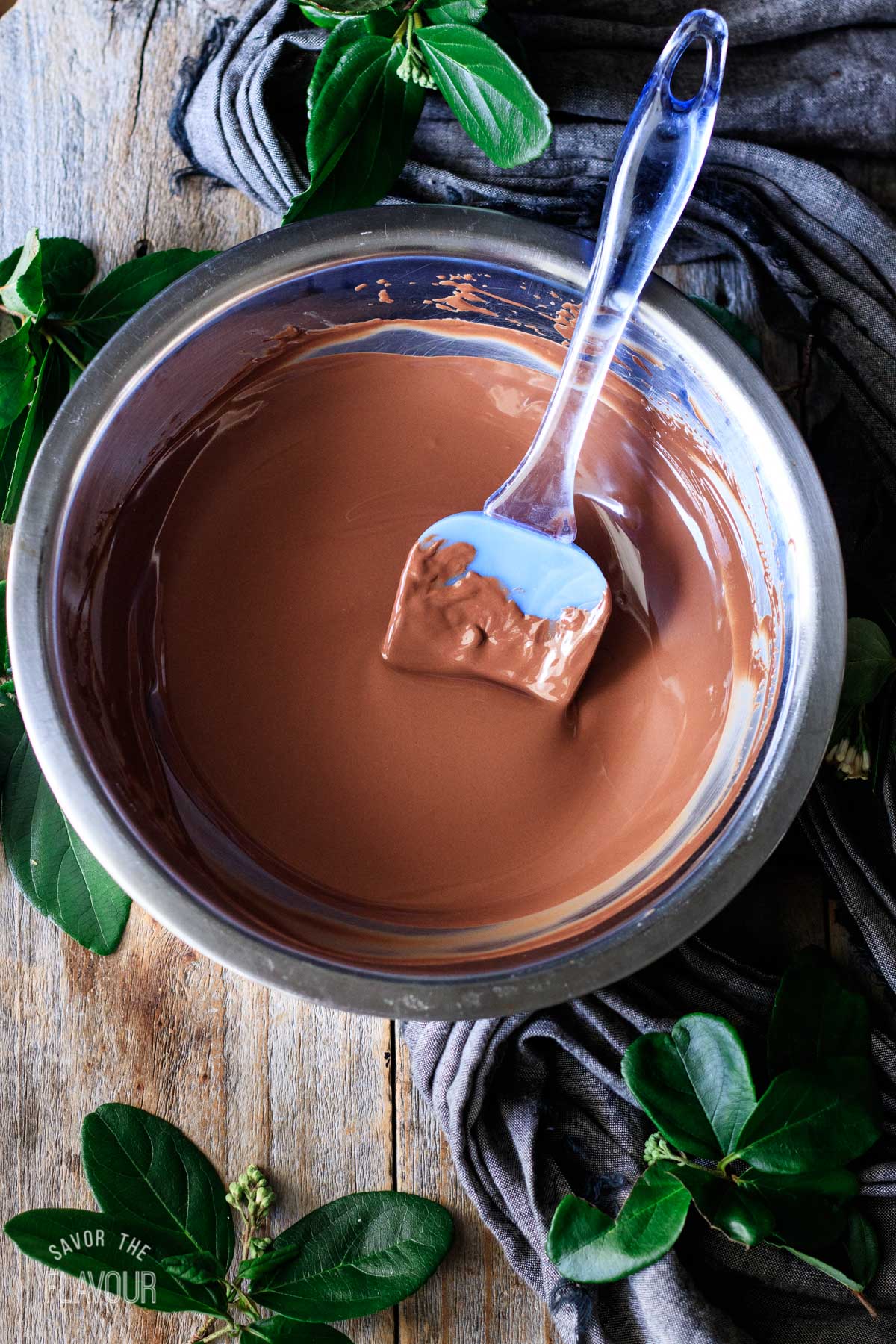 melted semisweet chocolate in a bowl with a spatula