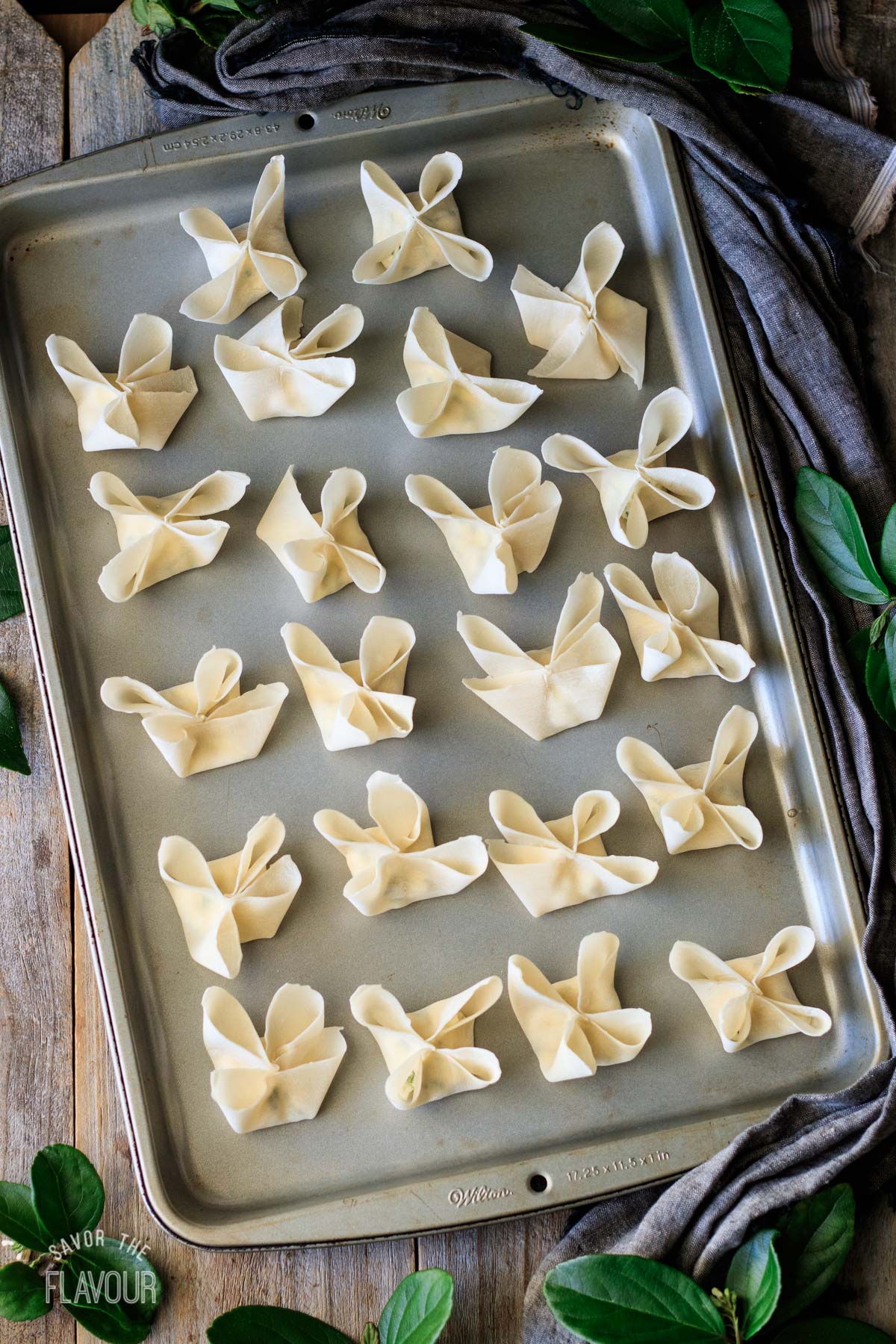 a tray of cream cheese rangoons before deep frying