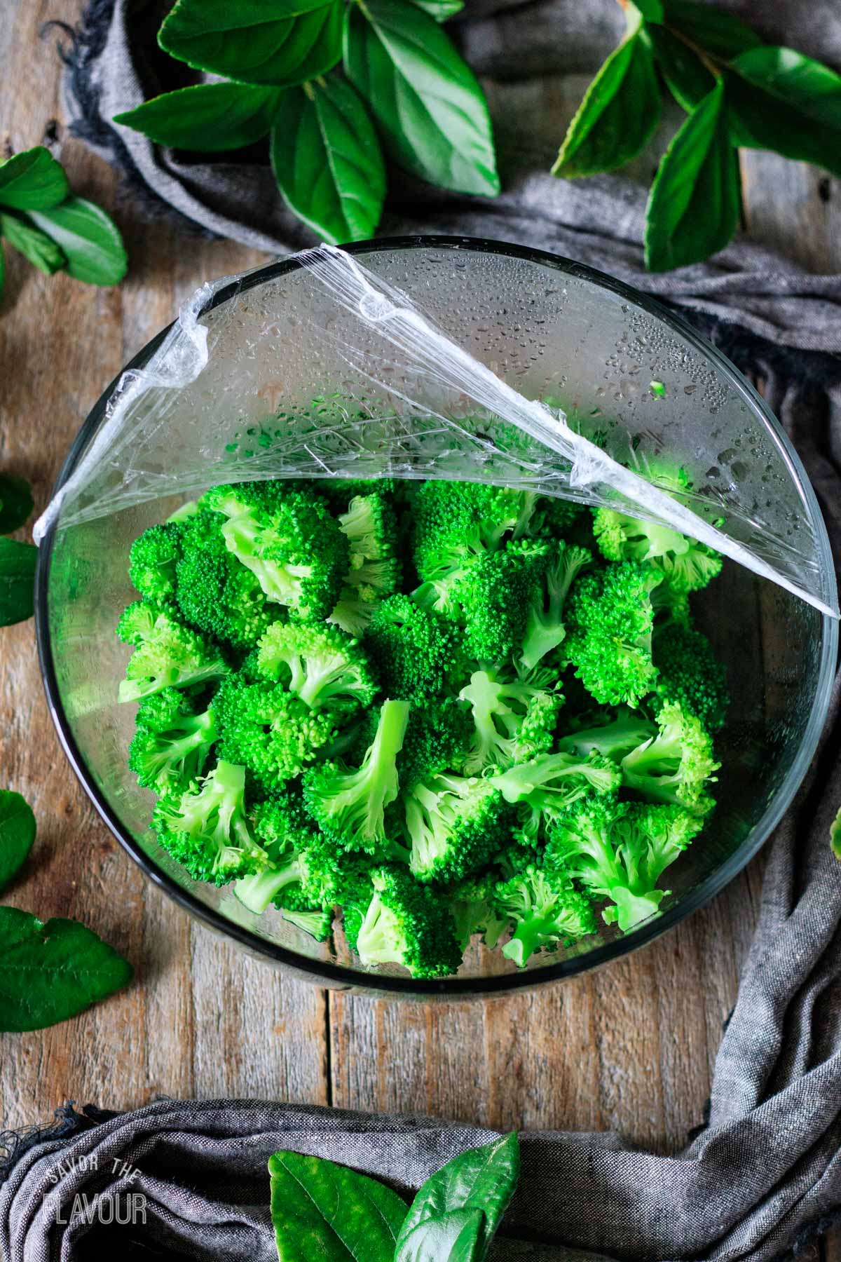 steamed broccoli florets in a glass bowl
