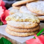 stack of three lemon drop cookies with one broken in half