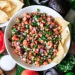 bowl of copycat Chipotle fresh tomato salsa with tortilla chips