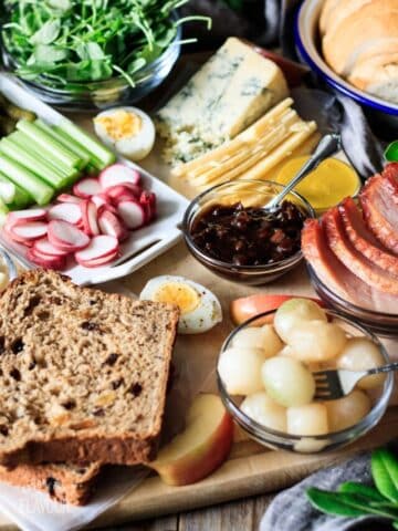 bowl of chutney with boiled eggs, ham, onions, cheese, and veggies