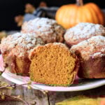 closeup of half of a Panera pumpkin muffin on a white plate