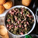 white serving bowl filled with collard greens