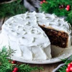 iced Christmas cake on a large white plate