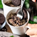 person holding a forkful of Oreo mug cake