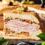 slice of muffaletta sandwich on a cutting board