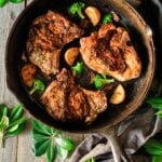 pork chops in a cast iron skillet