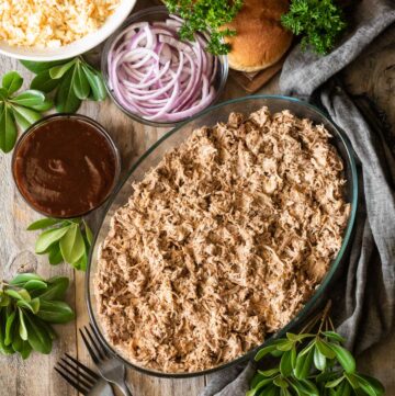glass casserole dish full of pulled pork