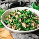 white bowl of kale and mushrooms