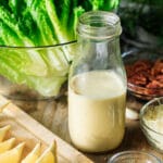 glass bottle filled with Caesar dressing