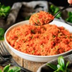 person holding a spoonful of French carrot salad