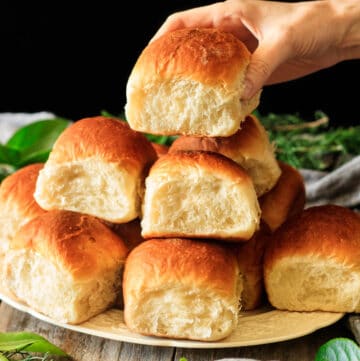 person holding a Hawaiian sweet rolls