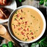 bowl of beer cheese soup with pretzel buns