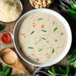 bowl of crab soup with oyster crackers and a spoon