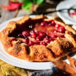 cranberry apple galette on a white plate