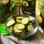 glass bowl of sliced pickles