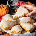 person holding a vegan pumpkin scone
