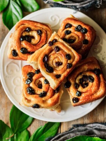plate of cinnamon raisin rolls.