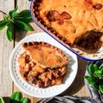 slice of beef and potato pie on a white plate
