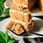 slice of coffee and walnut cake on a white plate