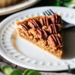 slice of pecan pie without corn syrup on a white plate