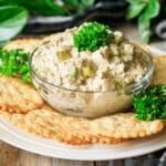 bowl of sardine salad with crackers