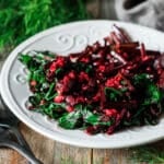 plate of sauteed beet greens with a fork