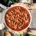 person holding a bowl of stuffed pepper soup