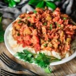 plate of okra and tomatoes with mashed potatoes