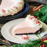slice of frozen peppermint pie on a white plate
