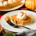 pumpkin pie bar on a white plate with a fork