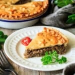 slice of tourtiere on a white plate