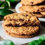stack of chocolate chipper cookies on wax paper