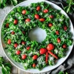 kale Christmas wreath salad on a large white plate