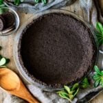 Oreo pie crust with a wooden spoon
