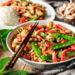 bowl of Thai stir fry with chopsticks