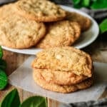 stack of white chocolate macadamia nut cookies on wax paper