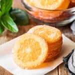 stack of candied orange slices on parchment paper