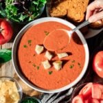 person holding a spoonful of Panera tomato soup