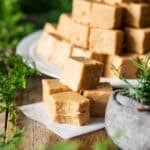 stack of peanut butter fudge on wax paper