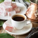 cup of Greek coffee with a piece of Turkish delight